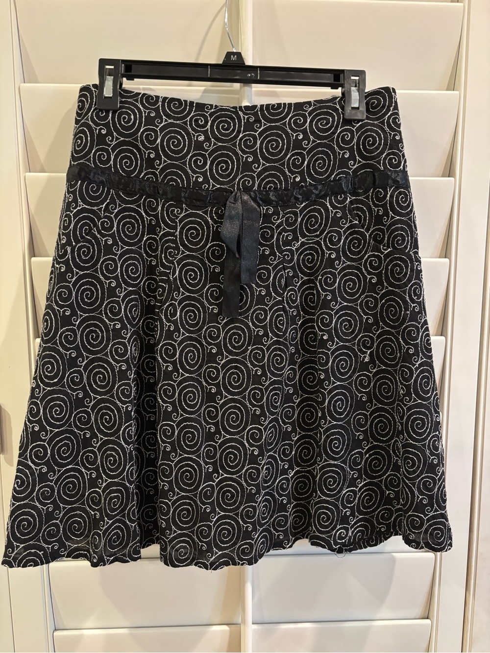 Women's Black Flared Skirt with White Embroidered Spiral Pattern, Ribbon Detail